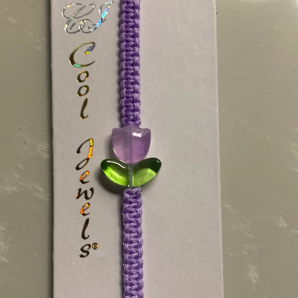 Purple adjustable corded Bracelet with tulip charm. NWT